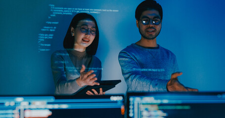 Group adult Asia male female software developers mentor leader manager talk strategy plan to executive write prompt AI bot IT app program nomad, video game, data center. Projecting slideshow code.