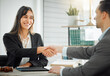 © KayJoint/peopleimages.com - Business people, man and woman with handshake, lawyer and client with deal, contract and partnership. Office, interview or thank you with attorney, legal aid and shaking hand for promotion or welcome