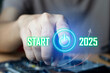 © tanit - Businessman presses start button for 2025 of business and data analysis developing towards success in 2025
