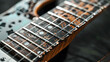 © Pongsathon - Focused image of the inlays and fret markers on a guitar neck