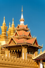 Wall Mural - of The stupa of Pha That Luang a large, gold-covered Buddhist stupa and a national symbol in the center of the city of Vientiane, capital of Laos.