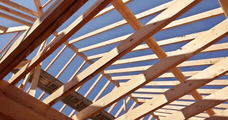 Wall Mural - Building new home using timber trusses framed with joints in roofing