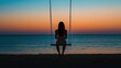 © kinara art design - A silhouette of a person on a swing by the ocean at sunset, evoking tranquility and reflection.