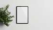 © Montaha Hossain - Minimalist Tablet Mockup with Green Plant on White Background