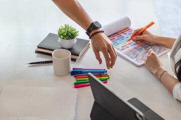 Wall Mural - smooth focus, group of web designers are working together to develop mobile responsive website with 