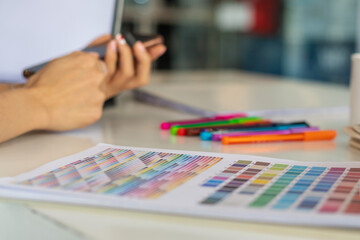 Wall Mural - smooth focus, group of web designers are working together to develop mobile responsive website with 