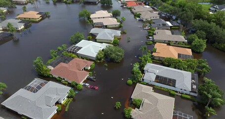 Poster - Flooding in Florida caused by tropical storm from hurricane Debby. Suburb houses in Laurel Meadows residential community surrounded by flood waters in Sarasota. Aftermath of natural disaster