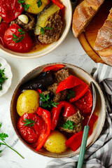 Cutlets with vegetables in a cauldron in Azerbaijani style.