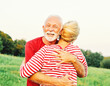 © Lumos sp - woman man outdoor senior couple happy lifestyle retirement together smiling love hug nature mature