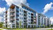 © florynstudio3 - Modern apartment complex with white and black exterior, balconies, and large windows. The buildings are surrounded by green trees and bushes, and there is a street in the foreground.