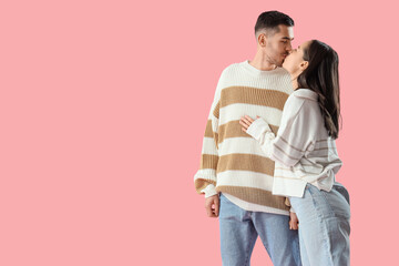 Poster - Happy young couple on pink background