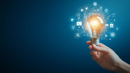hand holding light bulb with digital icons and network connection on blue background, representing i