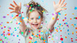 © NooPaew - Cheerful young girl playing with colorful confetti, full of happiness on a white background