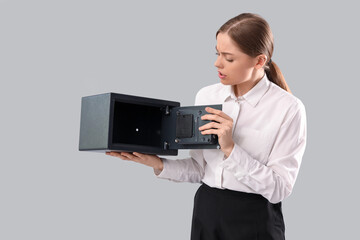 Sticker - Bankrupt businesswoman with empty safe on light background