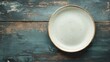 © akun - Empty Plate on Rustic Wooden Table