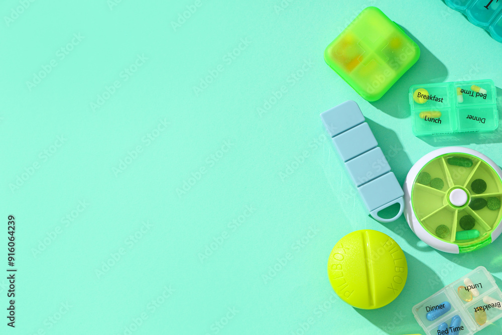 Different plastic containers with pills on turquoise background. Top view