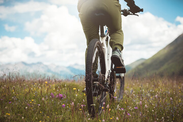 Wall Mural - Riding mountain bike in the flowering beautiful mountain top