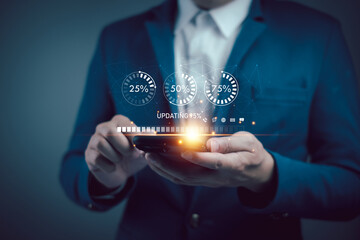 Businessman updating software on laptop with digital interface icons. Conceptual technology and innovation