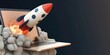 © Sascha - Innovative Technology Concept: Rocket Launching Out of Laptop Symbolizing Startup Success and Digital Growth