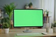 © SemangArt - Modern Workspace with Green Screen Monitor