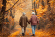 © pijav4uk - Happy senior couple holding hands, enjoying romantic autumn stroll on pathway