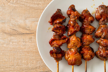 Wall Mural - grilled chicken gizzard skewer yakitori serve in izakaya style