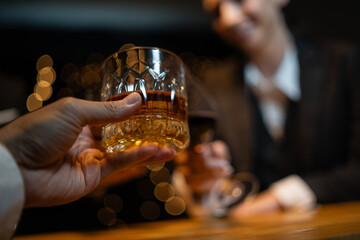 Wall Mural - Barwoman pouring whiskey whiskey glass..