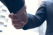 © tippapatt - Close up, businessmen making a handshake for successful deal,  business etiquette, congratulation, merger and acquisition, business meeting and partnership concepts