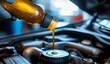 © Emqan - Mechanic Pouring Oil into SUV Engine with Focus on Hands and Bottle