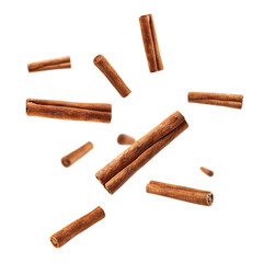 Wall Mural - Flying delicious cinnamon sticks, cut out