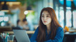 © hayley - Korean woman working in a modern office