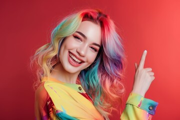 Young woman vibrant style poses multicolor hair. Extravagant hair and makeup create striking young woman's portrait. Power of self-expression elaborate and bold hair colors.