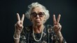 © inthasone - photo of a cool grandma with white hair, wearing sunglasses, showing the peace sign, and having fun isolated on a black background.