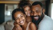 © Hope - happy african American family Father and daugthers siting together and hugging on sofa