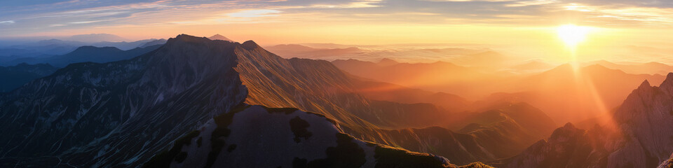 Wall Mural - a mountain range with a sun shining on it