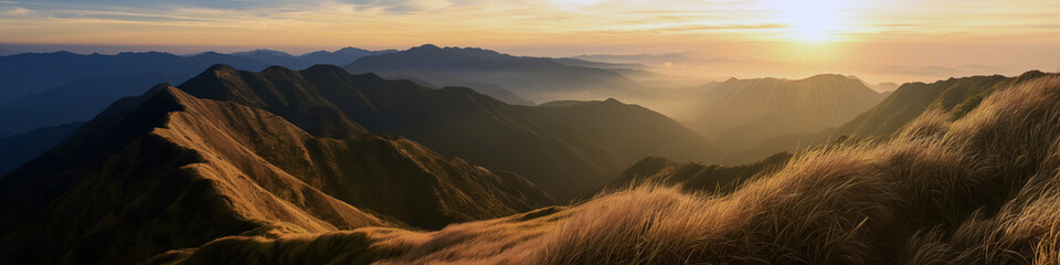Wall Mural - the sun is setting over the mountains, casting a warm glow over the landscape