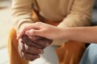 © Mediaphotos - Close-up of two individuals holding hands with one person's dark skin and the other's light skin, creating a contrast. Scene depict warm and supportive interaction