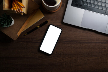Wall Mural - Smartphone, notebook, coffee cup and keyboard on rustic wooden table. Top view with space for text.