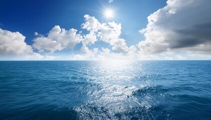 Wall Mural - blue sea or ocean with sunny and cloudy sky