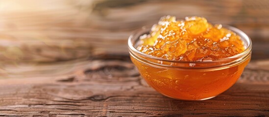 Aufkleber - Orange jelly in a bowl on a tabletop with ample copy space for adding text to the image