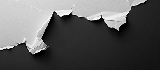 Aufkleber - Copy space image of torn paper against a black background