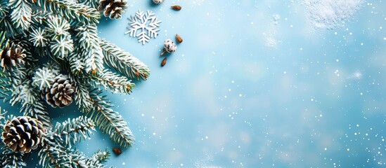 Aufkleber - Snowy fir tree branch snowflakes and fir cones on light blue backdrop with copy space image for Christmas winter holidays Merry Christmas or Happy New Year concept