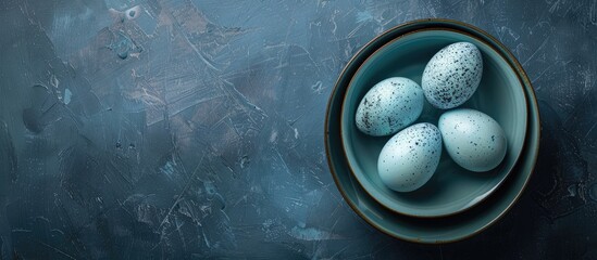 Aufkleber - A flat lay photo featuring three blue Easter eggs in a ceramic bowl on a dark blue backdrop with selective focus offering copy space image