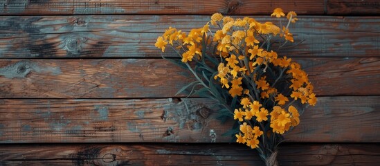 Aufkleber - A lovely yellow flower arrangement sits on a backdrop of wood offering space for text or graphics. Creative banner. Copyspace image