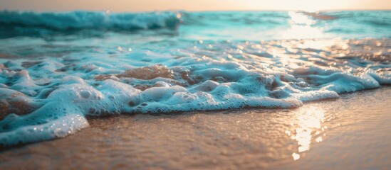 Poster - Sandy beach with gentle ocean waves in the background ideal for copy space image