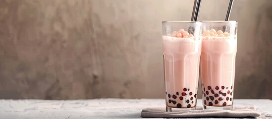 Aufkleber - A popular image of two glasses of yummy milk bubble tea with tasty tapioca pearls known as Boba milk tea displayed in a modern setting with room for text or design elements. Creative banner