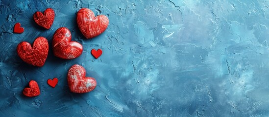Aufkleber - Romantic Valentine s Day concept with heart shapes on a blue surface offering a copy space image for personalization