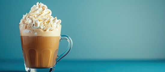 Poster - A glass of coffee with whipped cream on a blue background perfect for a copy space image