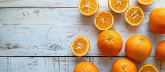Aufkleber - A flat lay copy space image of oranges displayed on a white wooden surface from a top view