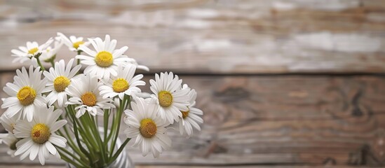 Poster - A wooden background hosts a bouquet of daisies with a white blank sheet evoking cleanliness fragrance and skincare Perfect for a copy space image